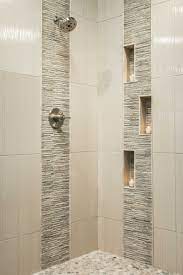 A popular tile design for a bathroom is an accent wall using small wall tiles in a contrasting color. Bathroom Shower Tile Bathroom Remodel Shower Modern Shower Design Patterned Bathroom Tiles