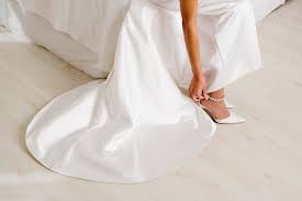 A white or black tuxedo and white shirt with black bow tie. White Wedding Dress Ivory Shoes Wedding Dress For Guest