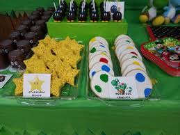 Birthday Decorated Rice Krispie Treats Mario Brothers Themed Treats Star Rice Krispies Yoshi Egg Cookies Bob Omb O Super Mario Bros Birthday Party Mario Birthday Party Super Mario Birthday Party