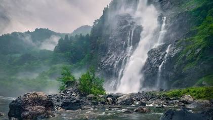 The powerful mist and drop of Nuranang Falls, AI generated