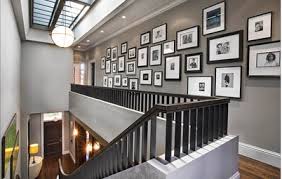 However, designers suggest saving personal images for more private spaces like a family room, a hallway, or a bedroom. How To Design A Family Photo Wall