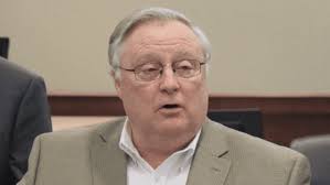 Indicted Georgia insurance commissioner suspends himself