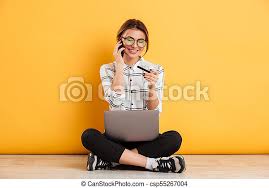 Maybe you would like to learn more about one of these? Cute Woman Speaking On Mobile Phone And Holding Credit Card While Sitting In Lotus Pose On The Floor With Silver Notebook Canstock