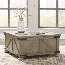 It lets you create a warm and inviting look with your favorite decor, collectibles, potted plants etc. Buy Signature Design By Ashley Aldwin Farmhouse Square Coffee Table With Lift Top For Storage Light Brown Online In Indonesia B07m9wdyrt