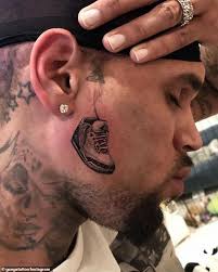 Oh wait.there is a similarity between the tattoo and rihanna but tmz reports that it's just a random woman. Chris Brown Gives Fans A Closer Look At His New Face Tattoo Of An Air Jordan Sneaker Daily Mail Online