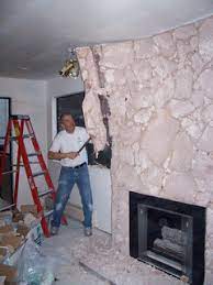 Painted rock fireplace huge improvement makes the room. Lava Rock Fireplace Makeover