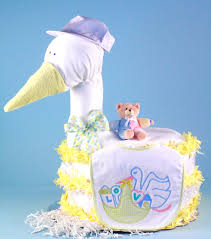 It looks great as a centerpiece at the shower and then there are actually a lot of ways to make these (go do a google image search for diaper cake and you'll find lots of inspiration) i'm just going to show. Diaper Cake Stork Baby Shower Gift By Silly Phillie