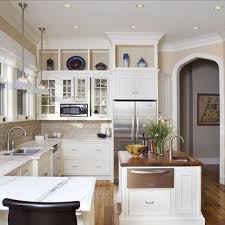 An extended kitchen soffit brings the lights in front of the wall cabinets and closer to the work area. Pin By Mary Thumm Rosser On Cottage Style Kitchen Redesign Kitchen Soffit Above Kitchen Cabinets Kitchen Design