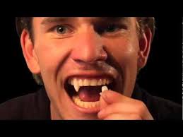 As soon as your natural teeth are dry, put a small dot of dental adhesive cream on the part of the fang that will be against your tooth. Halloween Tutorial How To Custom Fit Vampire Fangs By Scarecrow Youtube