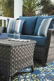 The Abbots Court 4 Piece Patio Set By Ashley Furniture Soft Driftwood Hued Resin Wicker Adds Romance Without T Patio Set Outdoor Patio Decor Outdoor Furniture