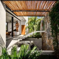 Bamboo feature acts as a partition between the bedroom and bath [design: 6 Creative Ways To Use Bamboo In Architecture And Interior Design