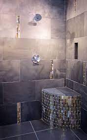 Hello and welcome to my awesome website of superior goodness! A Modernized Shower With Metallic Glass Accents Thetileshop Beach House Bathroom Beautiful Bathroom Designs Toilet Design