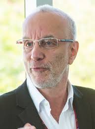 Axelrod to students: “Steer us to a better place.”