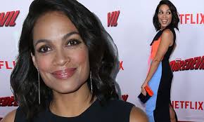 Rosario Dawson mixes pink, orange and sky blue for her outfit at Daredevil  premiere in LA