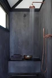 this dark shower with copper accents that still has plenty of light concrete bathroom concrete shower amazing bathrooms