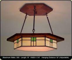 This piece is hand crafted from 500 pieces of hand cut, stained art glass. I Love This Guys Stuff Mission Studio Craftsman Lighting Dining Light Fixtures Craftsman Chandeliers