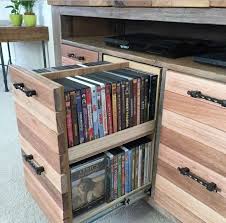We would like to show you a description here but the site won't allow us. Do You Have A Stash Of Dvds That You Reach For On A Rainy Day If It S Too Difficult To Let Diy Dvd Storage Reclaimed Wood Media Console Tv Stand