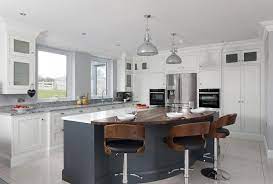 A Wall Of Floor To Ceiling Cabinetry Furnishes The Room And Gives This Kitchen Fabulous Storage Ki Modern Kitchen Design Kitchen Remodel Small Kitchen Design