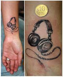 Rose with microphone and headphone tattoo on back shoulder. Pin On Tattoos That I Love