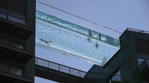 The pool was perceived as emblematic of economic inequalities in london upon its unveiling in may 2021. Londoners Cool Off In Sky Pool Suspended 115ft In The Air Between Two Buildings Video Uk News The Guardian