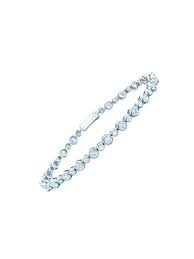 Tiffany style four claw diamond tennis bracelet in 14k. New Takes On The Tennis Bracelet Trend Vogue Jewelry Diamond Tennis Bracelet