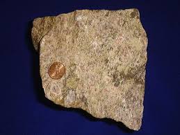 Cooked very lightly, so the meat is still red (in the case of steak or beef in the general sense). Rare Earth Element Wikipedia