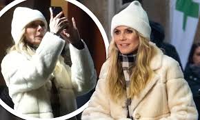 She has appeared on the cover of the sports illustrated swimsuit issue and in 1999 became the first german model to become a victoria's secret. Heidi Klum Wraps Up In Fluffy Coat As She Continues To Shoot Germany S Next Top Model In Berlin Daily Mail Online