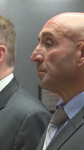 Warren police officer pleads not guilty to cyberharassment