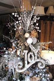 Instead of reaching for the same classic angel or star christmas tree topper this holiday season, think outside the box and consider diy. Twigs Burlap Styrofoam Balls And Ribbon Combined In A Detailed Tree Topper Unusual Christmas Trees Creative Christmas Trees Christmas Decorations