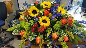 & they are chosen for their beauty and significance. Colorful Casket Spray Cemetery Flowers Casket Flowers Memorial Flowers