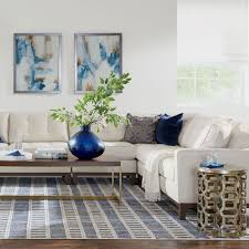 Update your living room for spring summer fall or winter just by swapping wall art pillows and florals. Living Room Decorating Ideas Living Room Inspiration Ethan Allen