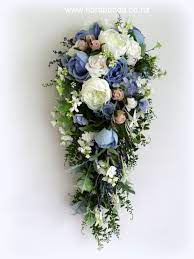 Maybe you would like to learn more about one of these? Long Trailing Bouquet In Blues Whites And Soft Antique Pink All Artificial From Www Florabunda Co Nz Floral Wedding Flowers Trailing Bouquet