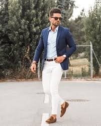 Creamy Jeans A Light Blue Shirt A Navy Blazer Brown Moccasins And Sunglasses For A Timeless Wedding Outfit Men Mens Summer Wedding Outfits Wedding Guest Men