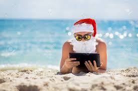 Santa Claus On The Beach With A Tablet In Hands Christmas Holidays Stock Photo Picture And Royalty Free Image Image 64385423 En aquel entonces no podía encontrar un buen dibujo de santa de vacaciones, así que se me ocurrió esto. santa claus on the beach with a tablet in hands christmas holidays