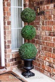 Outdoor topiary balls & ball topiaries. The Easiest Diy Topiary Trees On A Budget Topiary Decorating Ideas Outdoor Topiary Porch Plants Porch Topiary