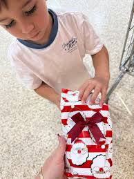 Boys give christmas gift to stranger's son