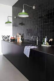 zwarte keuken met zwarte tegeltjes en groene vintage lampen kitchen design kitchen remodel kitchen interior