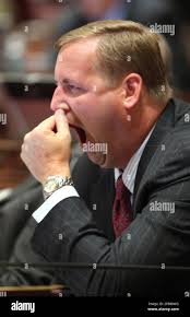 State Sen. Jeff Denham, R-Merced, stifles a yawn during the early morning  hours at the Capitol in Sacramento, Calif., Friday, July 24, 2009.  Lawmakers worked overnight voting