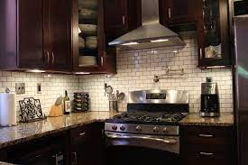 White kitchen cabinets with stainless steel backsplash. Subway Tile Backsplash Trendy Kitchen Backsplash Backsplash With Dark Cabinets Brown Kitchen Cabinets