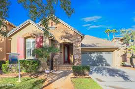 Oversize tile floors, upgraded kitchen with modern cabinets , granite step inside the gorgeous entry to the open floor plan main living room. 13228 N 153rd Drive Surprise 85379