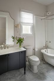 This guest bath has a light and airy feel with an organic element and pop of color. Watch A Houzz Editor Discuss 4 Small Bathroom Design Ideas