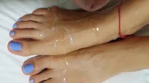 Guy with a fat cock cums on girls sexy feet with blue nail polish