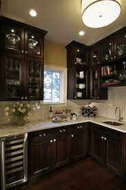 dark wood kitchen cabinets with glass