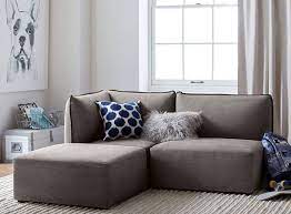 10 Couches For Small Spaces That Won T Disappoint Mymove Small Room Sofa Couches For Small Spaces Small Living Rooms