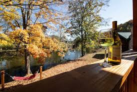 The camping cabin, directly on the little pigeon river, with full bath, kitchenette, outdoor fire pit, and charcoal grill is the perfect option for those who do not like to rough it. Super Clean River Cabin Fast Wifi Keyless Entry Cabins For Rent In Pigeon Forge Tennessee United States
