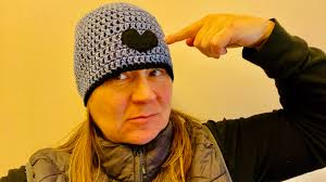 Crocheting micro hats for donation