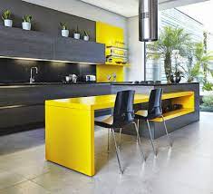 Modern tone comes from the cabinet that all are painted in the bright shade of yellow. Modern Design Takes Kitchen Makeovers From Basic To Elegant Yellow Kitchen Designs Kitchen Design Small Modern Kitchens