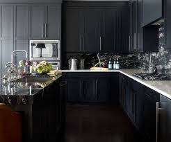 Check out how intense the contrast of black cabinets with a white backsplash is in this look reinforced with gallery space! 30 Sophisticated Black Kitchen Cabinets Kitchen Designs With Black Cupboards