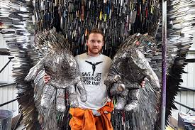 The giant eyes sculptures behind harlan's desk. Sculptor Spends 2 Years To Build Knife Angel Out Of 100 000 Weapons However Government Rejects It Bored Panda