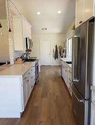 Black white tile countertop with backsplash. White Brass Boho Chic Kitchen West Oaks Construction